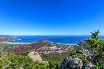 Scenic blue sky and blue ocen on the top of mountain. Summer time, treking to mount Bishop lookout, Wilsons Promontory Nation Park, Victoria, Australia.