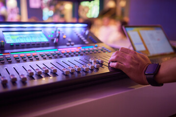 Sound mixer. Professional audio mixing console with lights, buttons, faders and sliders.