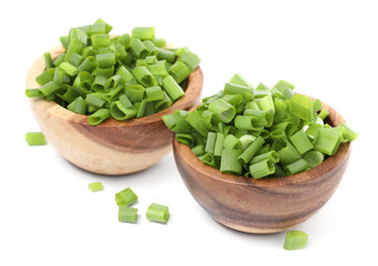 Chopped fresh green onion in bowls isolated on white