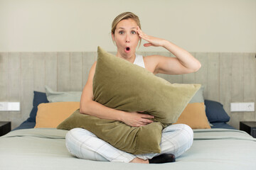 Obraz premium looking happy, astonished and surprised. pajamas or night wear concept