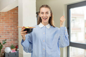 feeling shocked,laughing and celebrating success. ramen bowl concept