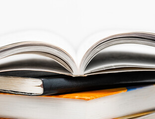 Open book on a stack close up. Business and education concept.