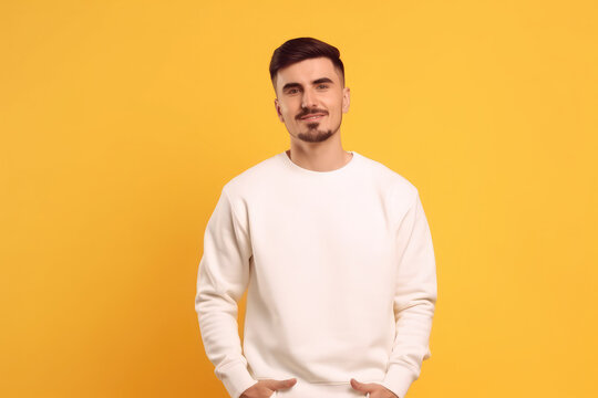 Young man wearing white sweatshirt mockup, at yellow background. Design pullover template, print presentation mock-up, generative AI