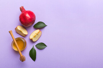 Flat lay composition with symbols jewish Rosh Hashanah holiday attributes on colored background, Rosh hashanah concept. New Year holiday Traditional. Top view with copy space