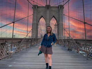 tourist woman on Brooklyn Bridge in New York