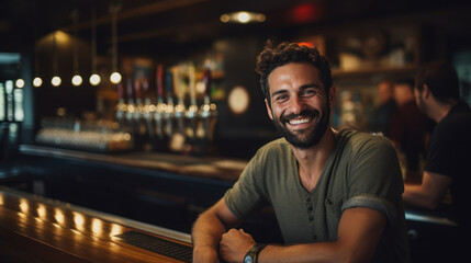 Cool male bartender serving craft beer at the bar - obrazy, fototapety, plakaty
