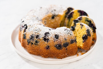Lemon blueberry bundt cake with powdered sugar dusting