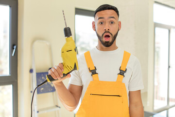 arab handsome man arab man feeling extremely shocked and surprised. handyman concept