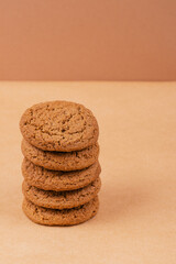 Stack of cookies. Oatmeal cookies on beige background.