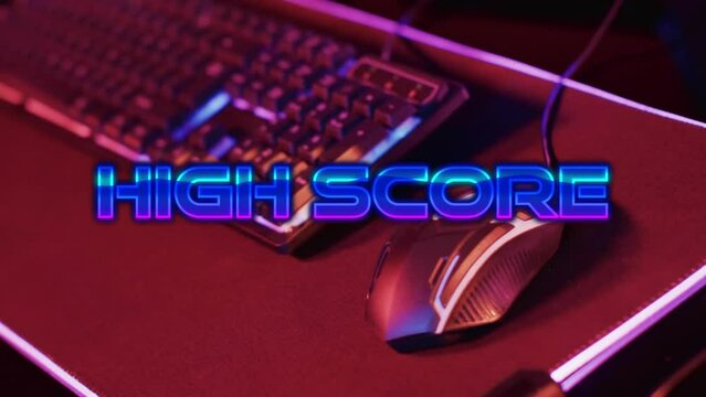 Animation of high score text, video game keyboard and mouse on neon background