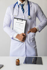 Healthcare Personnel Concept Portrait of a male doctor with inlaid ears posing with folded arms on...