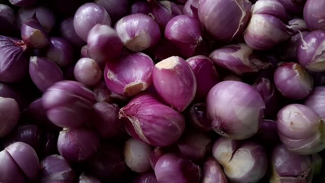 Red onion close up. Horizontal footage, Heap of raw peeled red onion and fresh