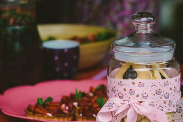Glass jar with cookies closeup.