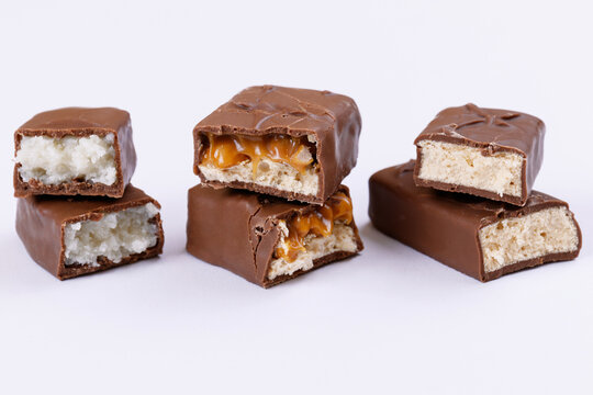 Set of chocolate bars broken into two pieces. Close-up.