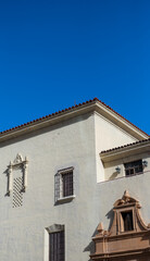 Fototapeta na wymiar Spanish Moorish Architecture Roofline with Sahara Blue Sky Above.