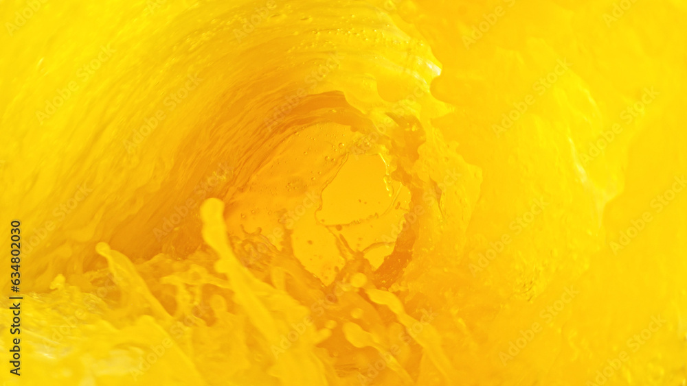Poster splashing orange juice creating twister shape.