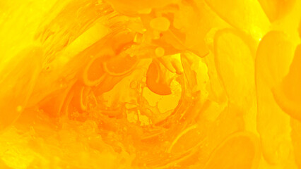 Splashing orange juice creating twister shape.