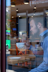 Young handsome man drinking coffee