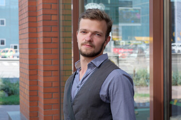 Fototapeta premium Street portrait of a young handsome man