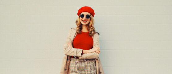 Autumn style outfit, stylish happy smiling young woman model wearing red french beret hat, jacket...