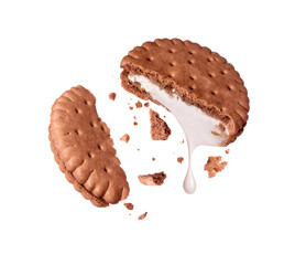 Crushed cookie with dripping dairy filling in the air isolated on white background
