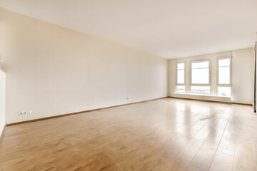 an empty living room with wood flooring and white walls in the room is very clean, but there is no furniture