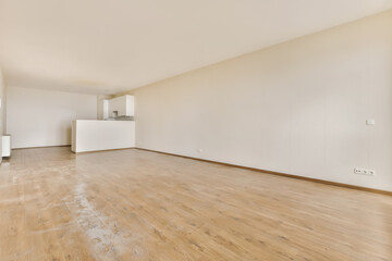 an empty living room with wood flooring and white walls in the room is very clean, ready to use