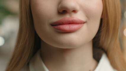Close up lower half part face unrecognizable female full plumped lips sexy girl woman with healthy...