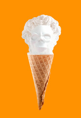 Male antique statue with skull face in waffle cone on orange background. Ice cream Halloween advertisment creative poster.