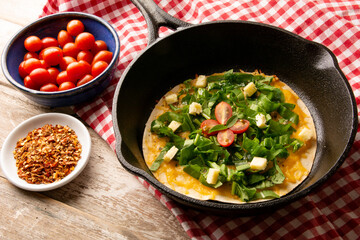 Cheesy Arugula Pizza with Cherry Tomatoes in Cast Iron Skillet
