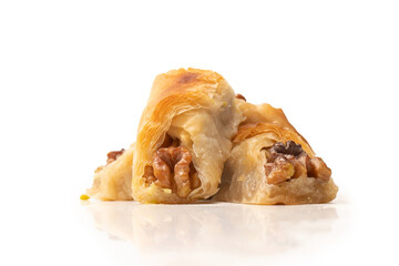 Delicious sweet baklava with walnuts isolated on white background.