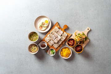 Korean food dish Stir-fried cartilage rice ball, seafood fish cake soup, boiled pork, tofu, kimchi,...
