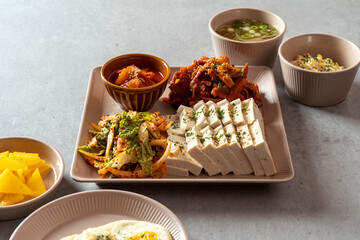 Korean food dish Stir-fried cartilage rice ball, seafood fish cake soup, boiled pork, tofu, kimchi,...