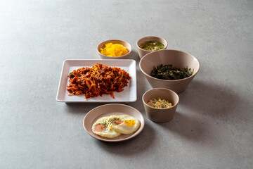 Korean food dish Stir-fried cartilage rice ball, seafood fish cake soup, boiled pork, tofu, kimchi, and stir-fried pork