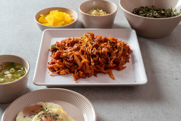 Korean food dish Stir-fried cartilage rice ball, seafood fish cake soup, boiled pork, tofu, kimchi, and stir-fried pork