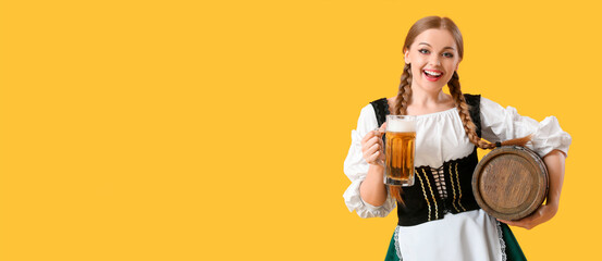 Beautiful Octoberfest waitress with beer and barrel on yellow background with space for text - obrazy, fototapety, plakaty