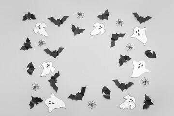 Composition with paper bats and ghosts on white background. Halloween celebration concept