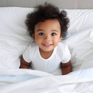 Happy African little child with cute dark curly hair is lying on the bed. Fictional person. Image generated by AI.
