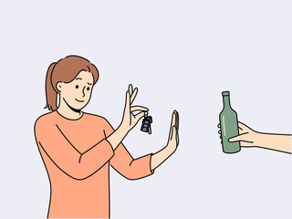 Woman driver refuses alcohol and holds car keys standing near human hand with bottle of beer. Concept of sobriety and awareness of driver who does not want to drive after drinking alcohol