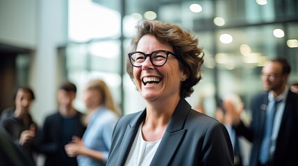 Smiling female politician wearing glasses. - obrazy, fototapety, plakaty