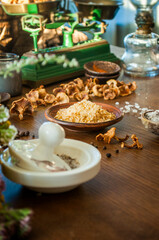 Herbs, seeds, salt and spices in wooden spoons and bowls on wooden table. Set of spices and herbs for cooking. Small bowls with colorful seasonings and spices