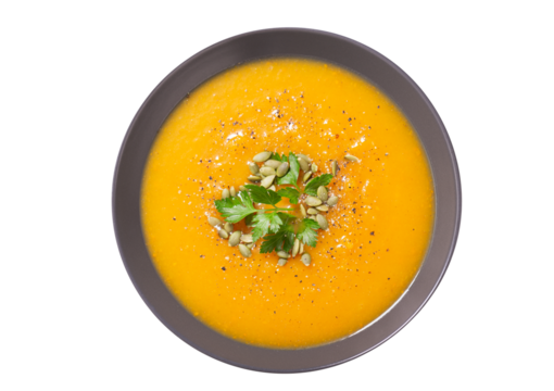 plate of pumpkin soup with parsley isolated on transparent background,  top view