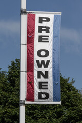 Pre Owned car banner at a dealership. With supply issues, used and preowned cars are in high demand.