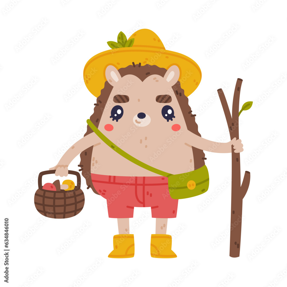 Wall mural cute hedgehog character in hat and shorts standing with stick and mushroom in basket vector illustra