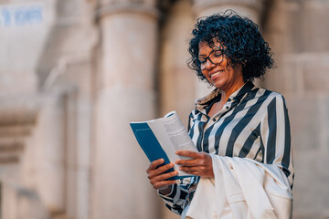 travel tourist woman with guidebook or map on the street