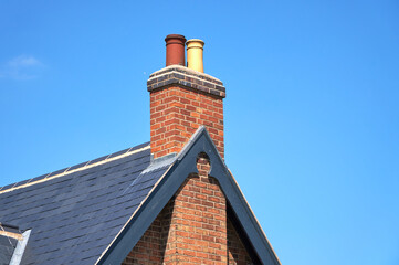 Grey slate roof and chimney stack example