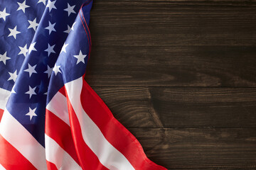 Being a part of the spirited celebration of Labor Day. Top view photo of national american flag on wooden background with empty space for promo or message