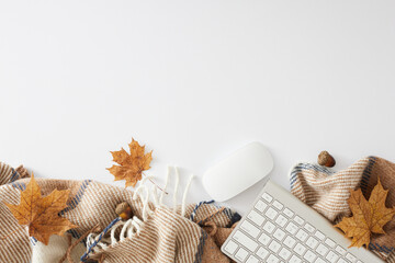 Embracing the comfort of a home office in fall. Top view flat lay of warm plaid, keyboard, acorns, autumn leaves on white background with empty space for promo or text