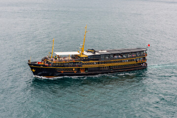 Fototapeta na wymiar Le Vapeur Magique Ship on Istanbul Bosphorus. Floating restaurant and tour ship at Bosphorus. Istanbul, Turkey.