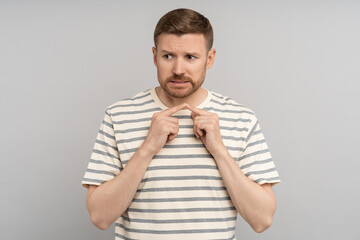 Nervous man connects his index fingers. Guy suffers from anxiety, uncertainty and doubts....